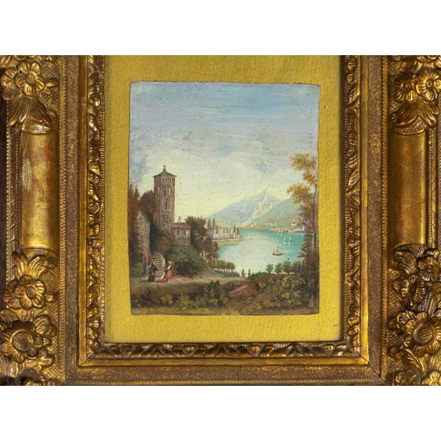 A grand view of an Italian lake, tower with the lake Garda (other name Benaco) and boats in the background. An Italian...