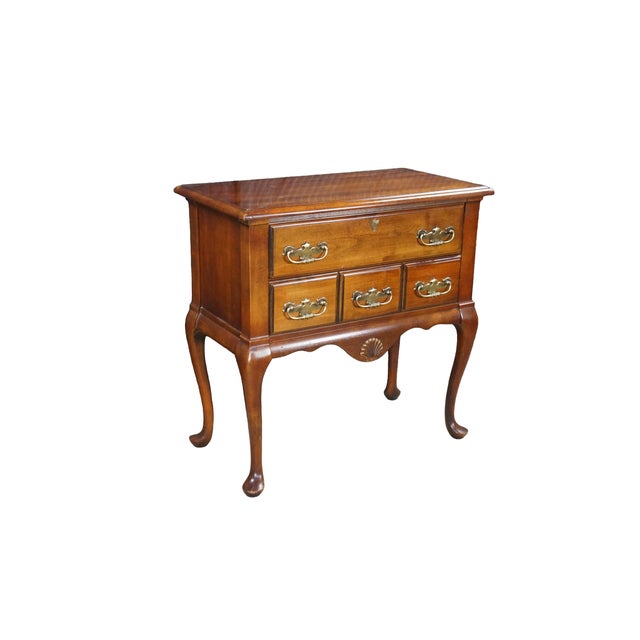 Vintage Queen Anne style lowboy dressing table by Mersman Tables (Somers Corp.) is beautifully crafted with a cherry frame...