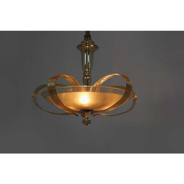 This Art Deco style chandelier was manufactured by ESC in the 1940s. Made of brass and curved glass, kept in original,...