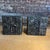 A pair of brutalist cube tables designed by Adrian Pearsall for Craft from the "Sculptura" line. Formed in silver colored...