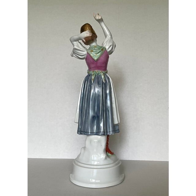 A graceful vintage Herend hand-painted porcelain Hungarian dancer figurine, beautifully sculpted in an expressive...