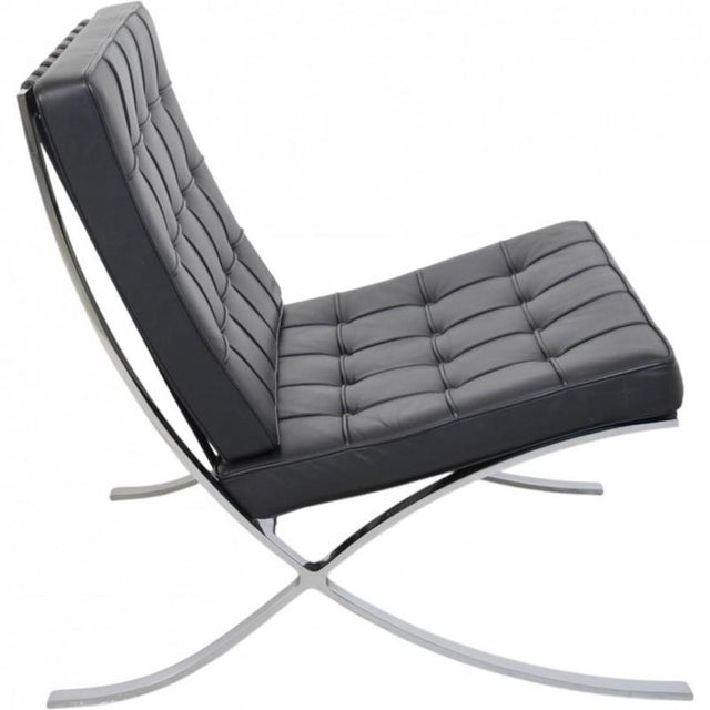 Ludwig Mies van der Rohe for Knoll, Barcelona chair upholstered in black leather, and with a steel frame. The chair is...