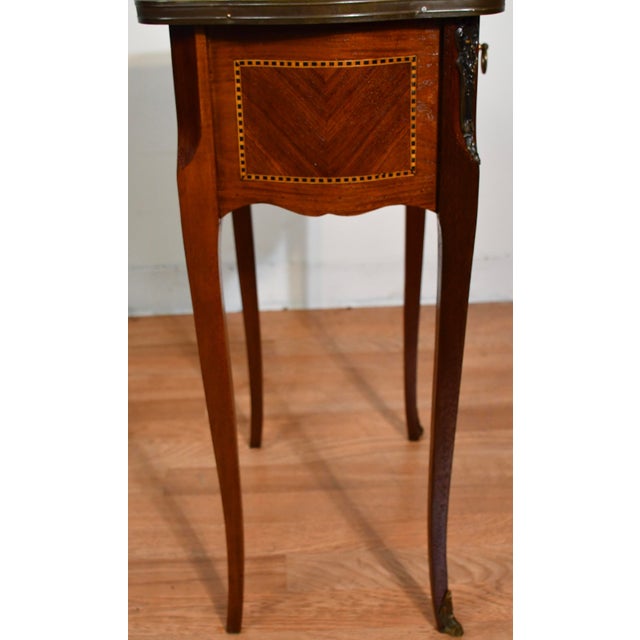 We are pleased to offer this beautiful Antique French Louis XV nightstand, from the 1910. Marked made in France on the...
