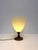An elegant Italian table lamp by L.L. , featuring a beautifully handcrafted Murano-style textured glass shade mounted on a...