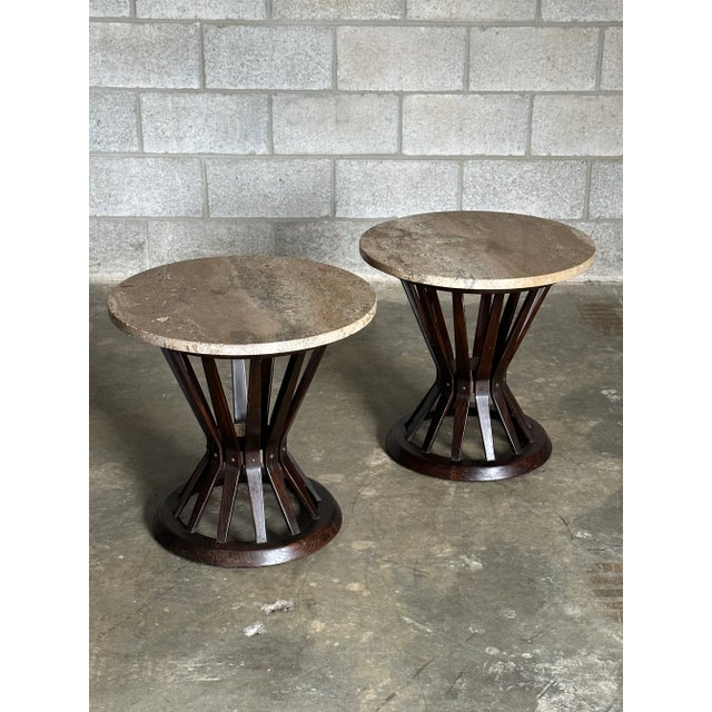 A rare pair of matching Edward Wormley Sheaf of Wheat Tables. Composed of an ash body with brass ring, they are complete...