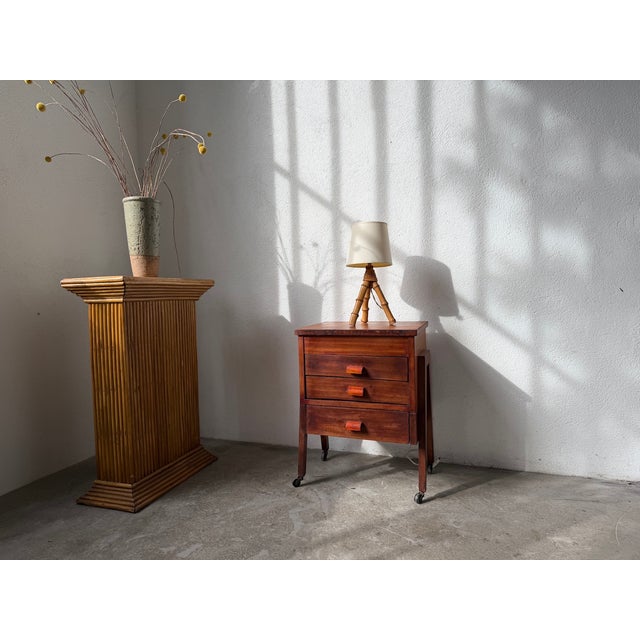 As cute as it is practical, this charming little side table from the 1930s-40s, crafted from exotic wood, will easily find...