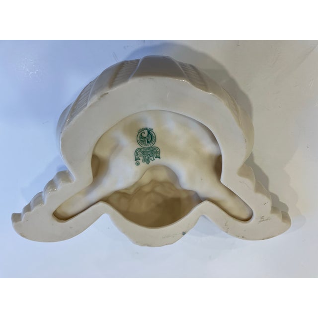 This fine quality ceramic wall pocket was made in Ireland in the 80’s by Beleek The 3rd green mark dates from 1965-1980
