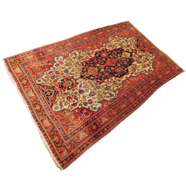 Rare antique Persian rug. Central medallion with pendants on ivory field displaying floral spray. Rich tone. Wool pile on...