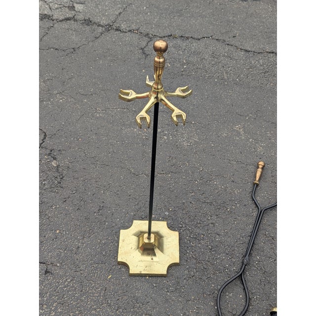 Elevate your hearth with this striking set of vintage brass-plated fireplace tools, a perfect blend of mid-century utility...