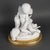 A large biscuit sculpture and gilded bronze frame, Napoleon III era, 19th century. Napoleon III period sculpture, 19th...