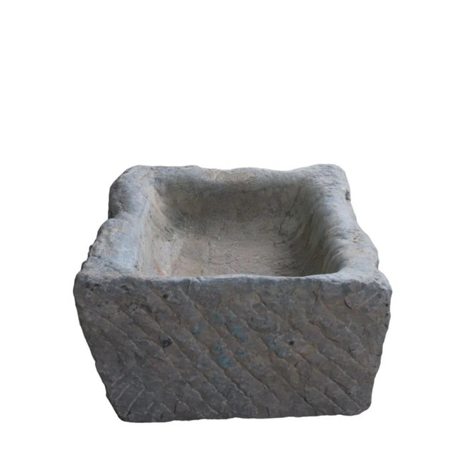 This stone trough is hand carved out one piece of stone and hand chiseled by the locals. This hand made stone planter is...