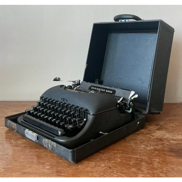 Step back in time with this exquisite Vintage Remington Rand Typewriter, a true testament to mid-20th-century...