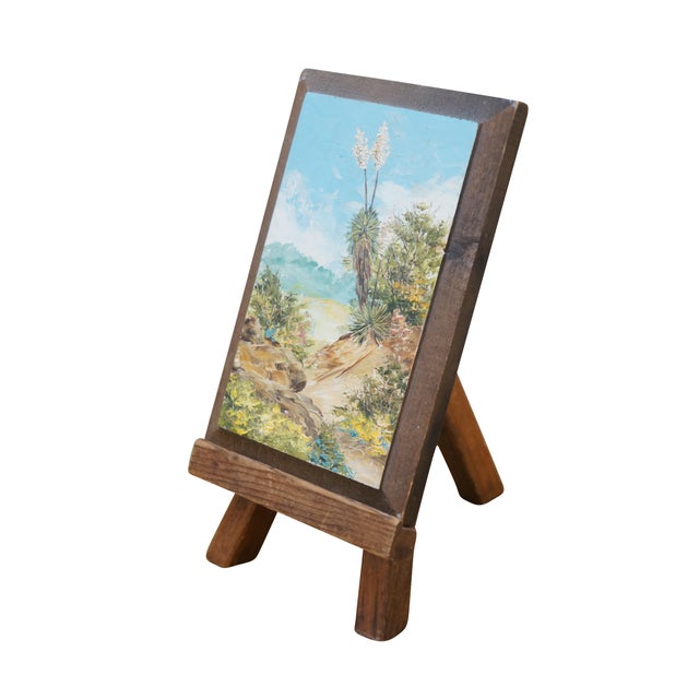 Late 20th century miniature desktop masterpiece landscape oil painting on board and easel showing a view of desert plants...