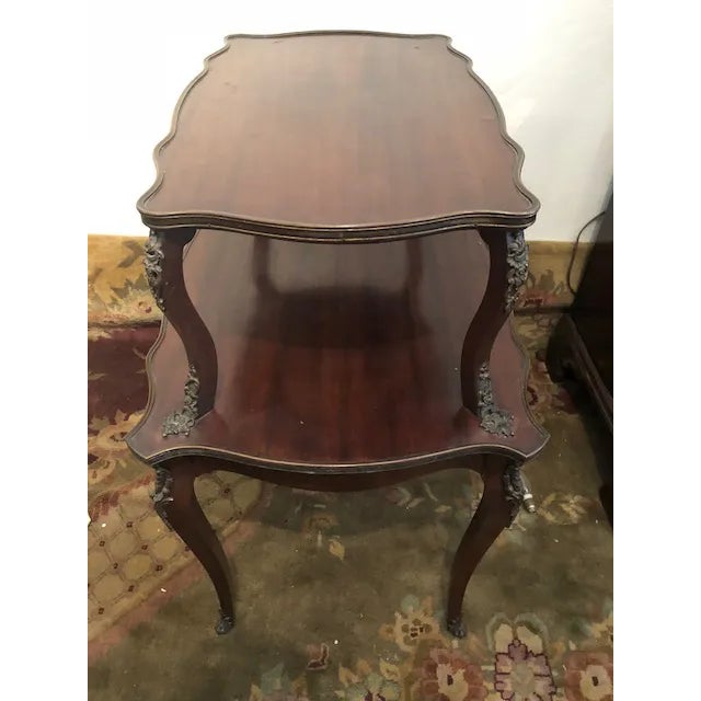 This is a very nice mahogany French antique Étagère is good condition. There is Ormolu to the legs and round the sides, I...