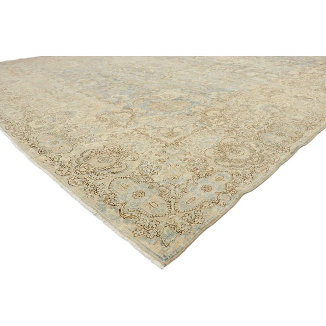 Distressed Antique Persian Kerman Palace Rug with Cotswold Country Cottage Style 11'00 x 17'04. With a timeless floral...
