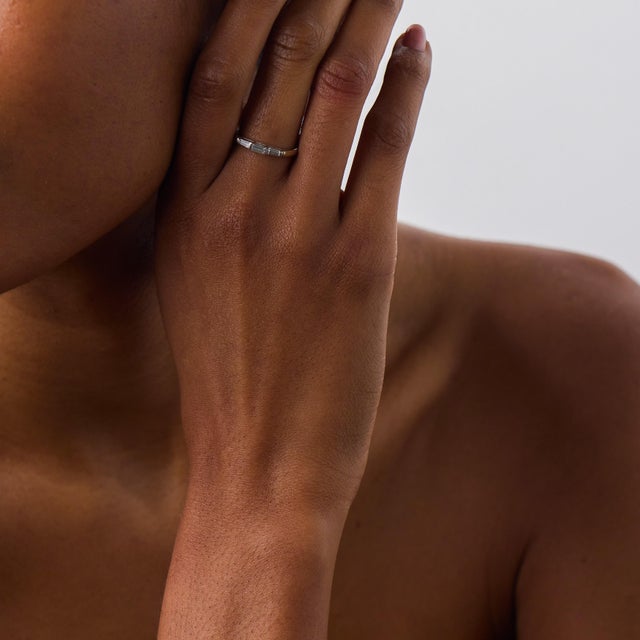 This elegant Mid Century diamond wedding band is a classic 1950’s design, crafted in 14k white gold and accented by 3...