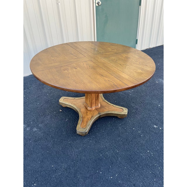 A beautiful vintage oak gaming table made by Henredon in the mid-20th century. This round oak gaming table features a low-...