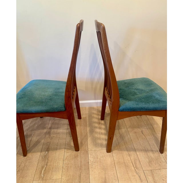 Stunning and rare set of two teak chairs from famed Danish designer Benny Linden. It has the classic railback style of his...