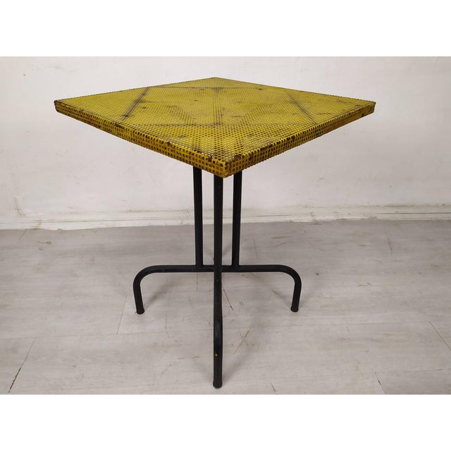 Perforated metal bistro table, 1960s in the spirit of Mathieu Mategot. This piece is designed in the style of the selected...