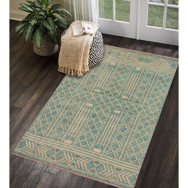This stunning hand-knotted Afghan Balouchi rug is a captivating addition to any decor. Crafted by skilled artisans, it...