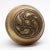 Brass door knob with a three fold swirl pattern. It is part of the E-14100 group in the 1905 catalog. The manufacturer is...