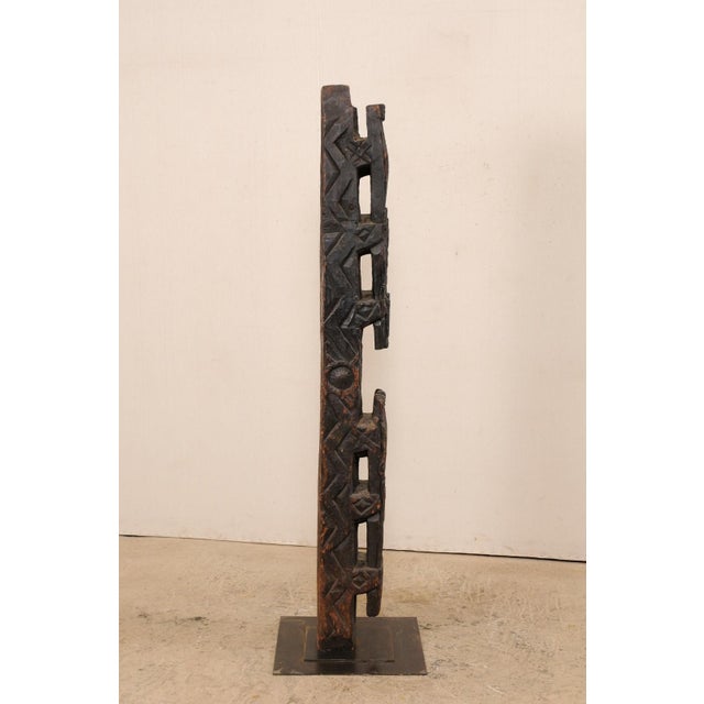 An early 20th century carved wood support beam from central Asia, custom mounted on iron stand. This antique wooden...