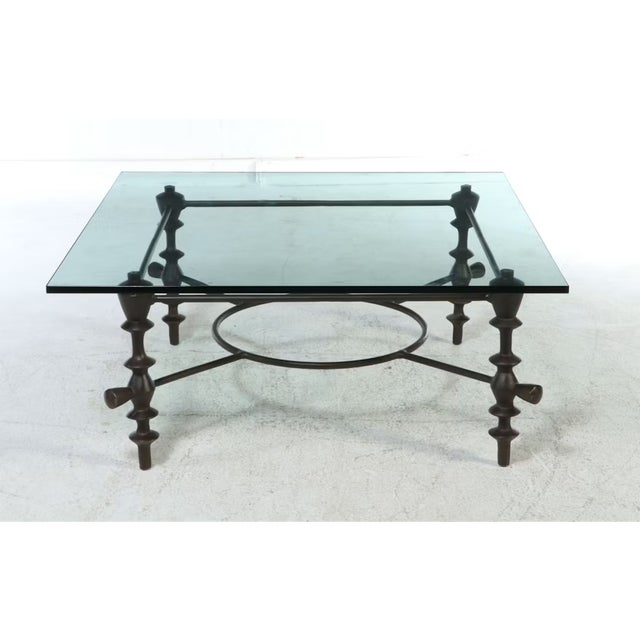 Evoking the primitive, organic modernism of the mid-20th century, this exceptional coffee table is designed in the...