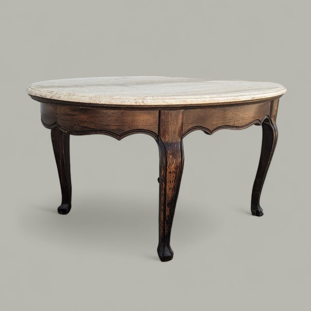 Vintage Faux Travertine-Top Coffee Table With Cabriole Legs. A vintage oval coffee table pairing a pale faux-travertine...