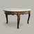Vintage Faux Travertine-Top Coffee Table With Cabriole Legs. A vintage oval coffee table pairing a pale faux-travertine...