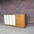 Harvey Probber Mid-Century Modern credenza or dresser crafted in mahogany with leather-front sliding panels and brass...