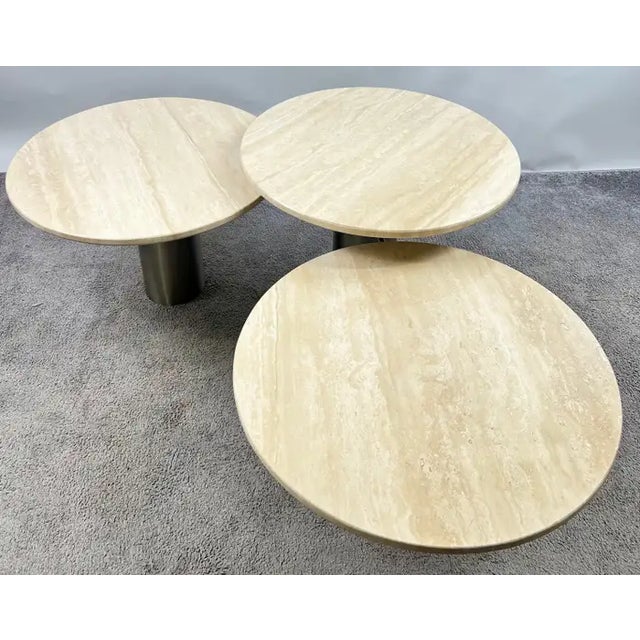 Organic Modern Travertine Three-Tier Circular Coffee Table with Metal Base This striking three-tier circular coffee table...