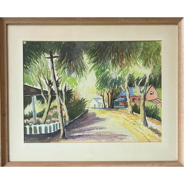 Large vintage watercolor of a southern beach town street scene. Unsigned and not dated. In original wood frame.