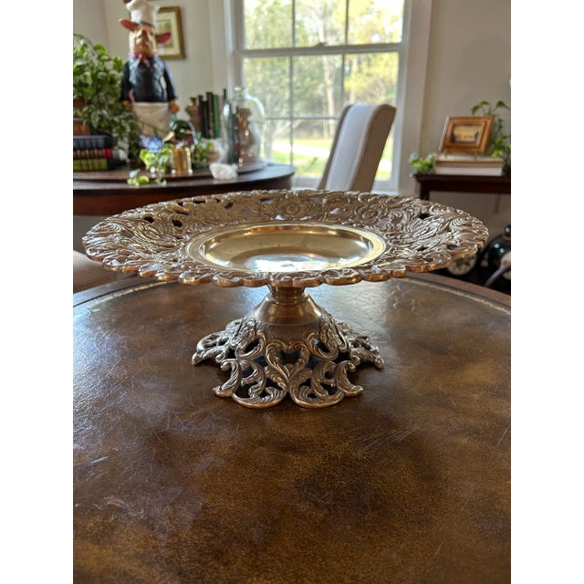 In Italy, a “tazza” would be a shallow dish on a pedestal for serving. A compote would be a deeper bowl. This cast brass...