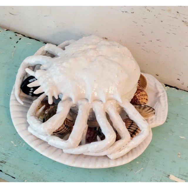 This vintage white Italian majolica pottery covered dish features a beautifully detailed crab design. The top of the crab...
