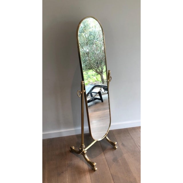 This beautiful and elegant neoclassical style psyche mirror is made entirely of brass with a beveled mirror. It is a...