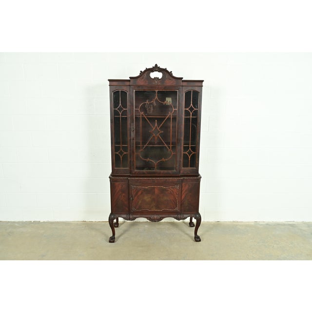 An exceptional Chippendale or Georgian style breakfront bookcase cabinet or dining cabinet By Romweber USA, Circa 1920s...