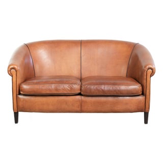 Sheepskin 2-Seater Sofa with Warm Cognac Brown Color Scheme and Finish with Black Piping For Sale
