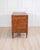 A refined Italian Louis XVI period chest of drawers, beautifully crafted in solid walnut and enriched with elegant...