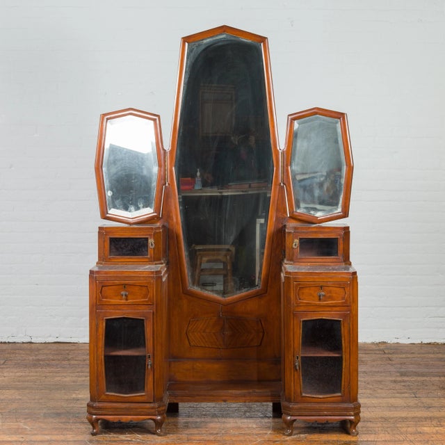 An Indonesian vintage ladies' dressing table from the mid 20th century, with three mirrors and marble accents. Created in...