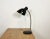 Vintage German bakelite desk lamp in Bauhaus style.It features a black bakelite shade, chromed gooseneck and cast iron...