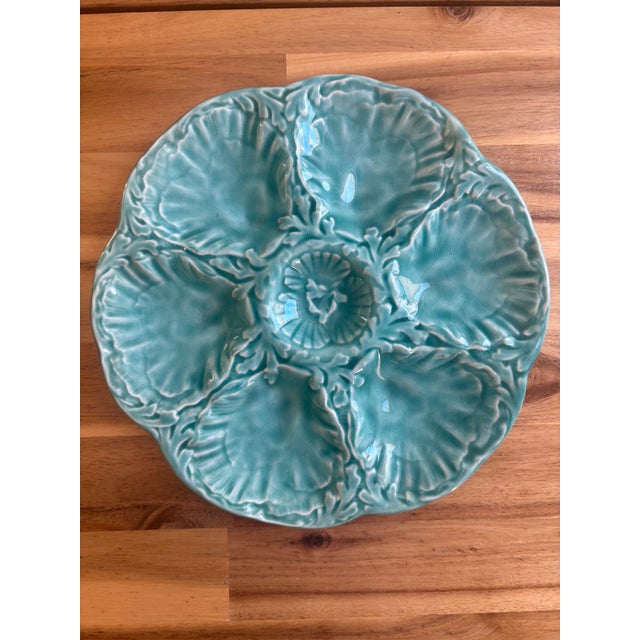 A glazed French faience oyster plate by Gien, one of France's premier faïenceries operating since 1821. Finished in a...