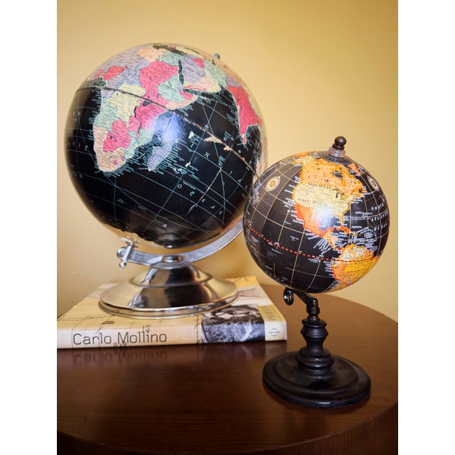 Late-1940s Replogle 12" Precision Globe with black oceans, designed by Gustav Brueckmann and produced in the USA. This...