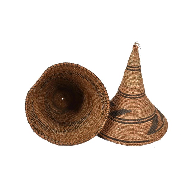 The Tutsi Tight Weave Basket with Lid from Rwanda epitomizes the artistry and tradition of the Tutsi community's weaving...