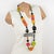 This gorgeous Angela Caputi, made-in-Italy, resin and Lucite extra-long necklace, has a playful design. The piece boasts...
