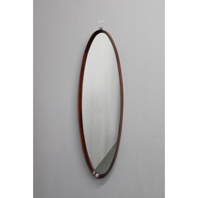 This elegant mid-century oval wall mirror was produced in Italy during the 1980s and exemplifies the era’s focus on...