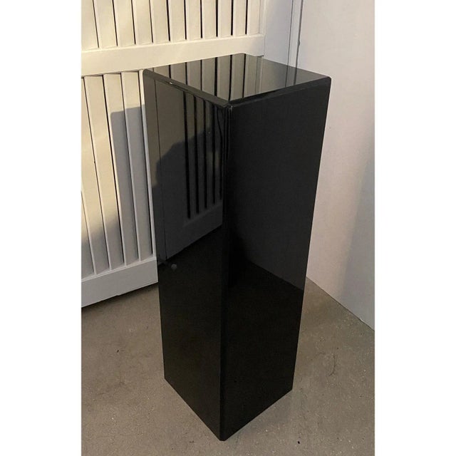 Vintage Pedestal Black Lucite 26.5" High. This piece dates to the 1990s and is fabricated in black Lucite.