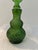 Lovely vintage green glass decanter in a diamond point design with twist off, hard plastic wrapped, glass stopper....