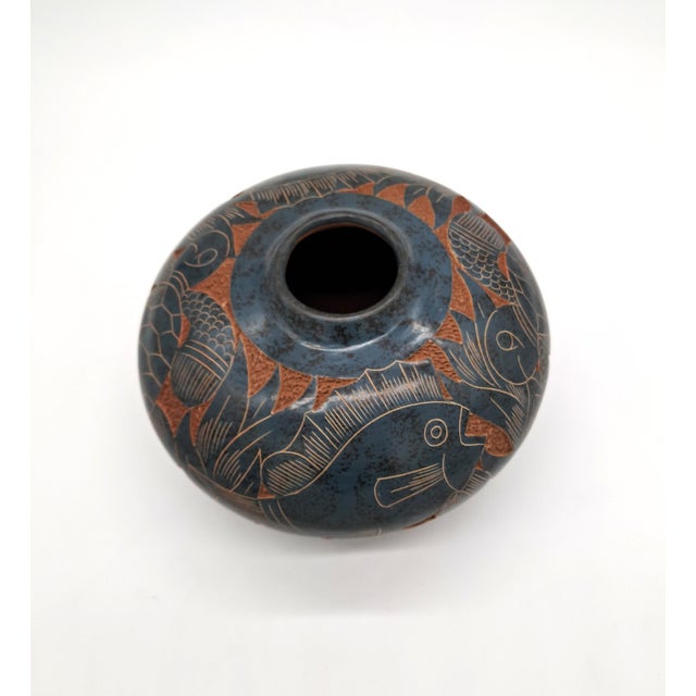 Beautiful hand-carved Nicaraguan studio pottery vase by artist Emir Calero, signed on the base. This rounded olla-form...