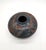 Beautiful hand-carved Nicaraguan studio pottery vase by artist Emir Calero, signed on the base. This rounded olla-form...