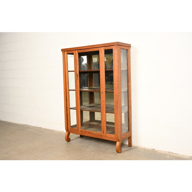 A beautiful antique Mission or Arts & Crafts period bookcase or display cabinet In the manner of Berkey & Gay USA, Circa...